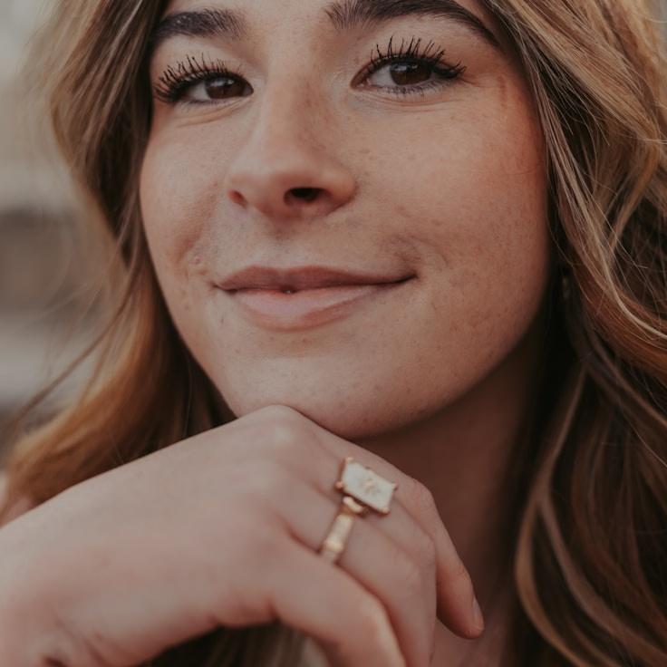 Kaveri Mehta, Lead Design Curator at Simple Grove Phase, reviewing corporate floral arrangements